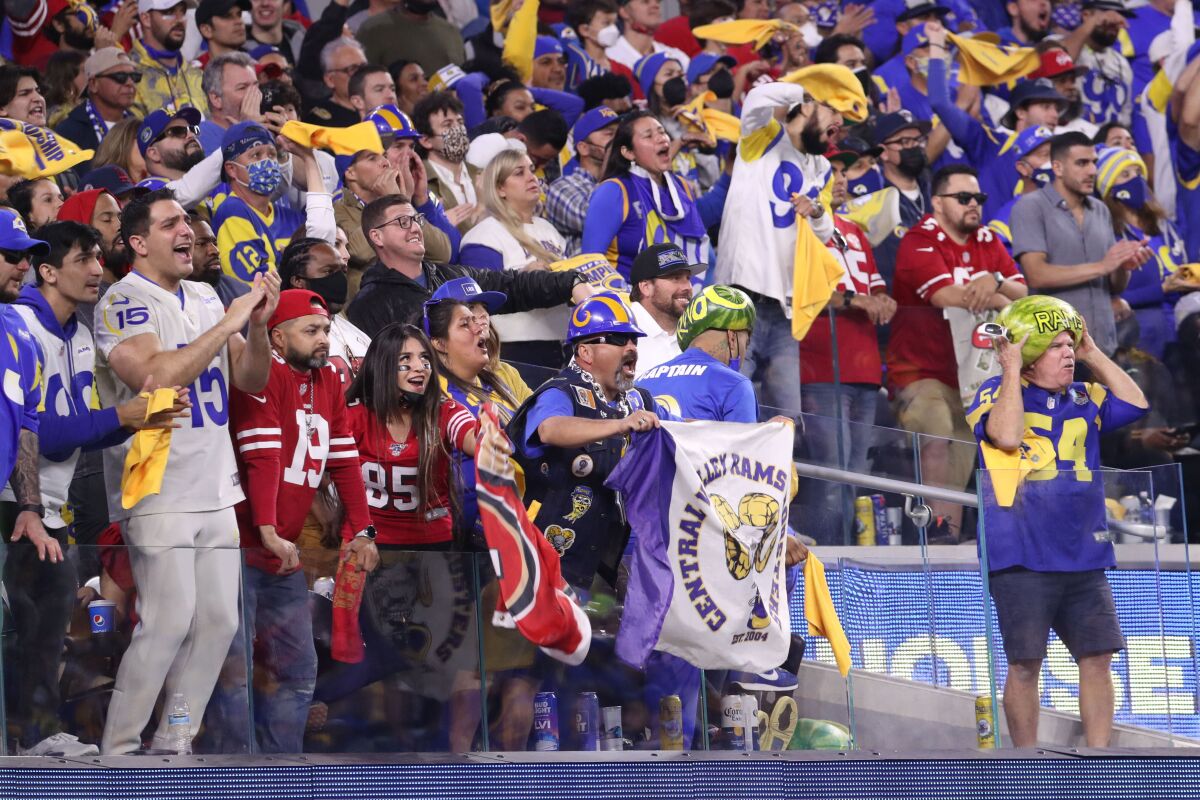 Fans cheer on the Rams and San Francisco 49ers during the NFC championship game Sunday at SoFi Stadium.