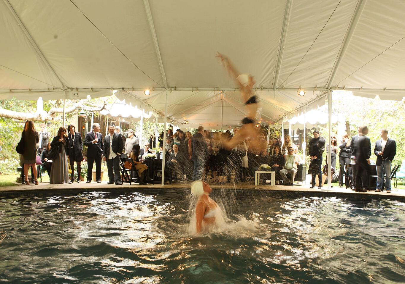 Members of a synchronized swimming team perform at a luncheon hosted by Robert Evans at a private residence on Feb. 21, 2008, in Beverly Hills.