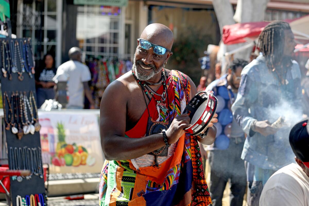 A man playing percussion in a drum circle