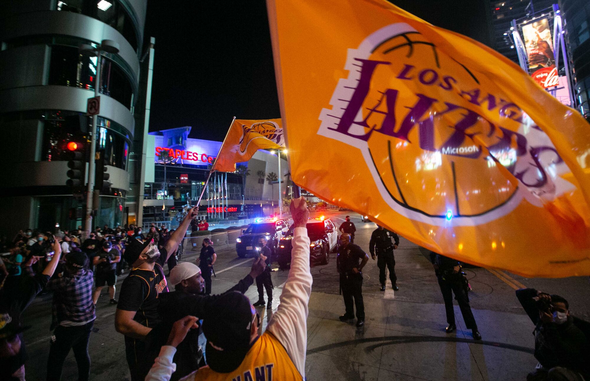 Fans gather near Staples Center to celebrate the Lakers' NBA Finals win over the Miami Heat on Sunday.