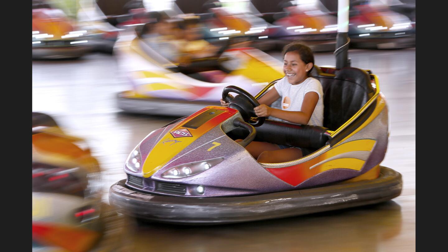 THINK Together's Shalimar Learning Center student Ximena enjoys the bumper cars during a visit to the Orange County Fair as part of the fair's inaugural OC Kids Club, in Costa Mesa on Wednesday, July 19, 2017.