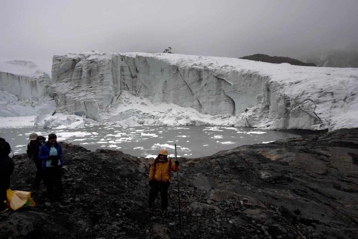 Scientists at the Pastoruri glacier in Huaraz, Peru, measure ice thickness.