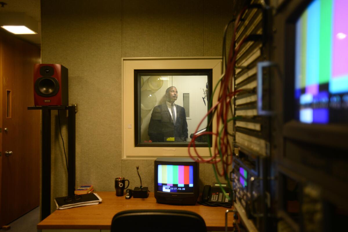 Bill Whitaker in a sound booth at the offices of "60 Minutes."