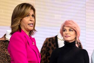 Hoda Kotb and Shania Twan standing together