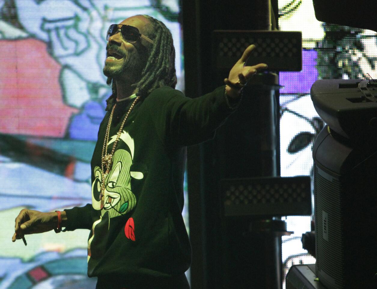 Snoop Dogg, a.k.a. Snoopzilla, looks funky but chic in his Pepe Le Pew sweat shirt during the record release concert for '7 Days of Funk' at the Exchange Los Angeles on Dec. 10.