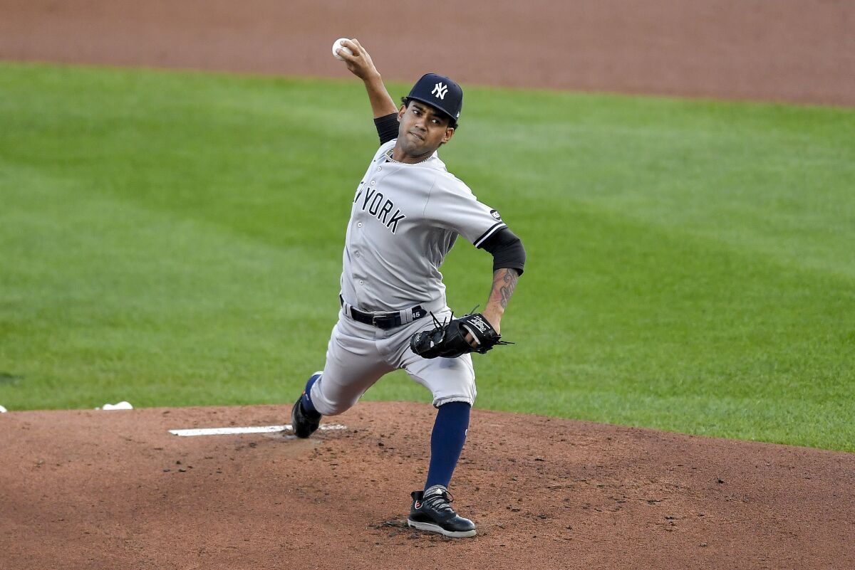 New York Yankees starting pitcher Deivi Garcia throws to a Toronto Blue Jays batter during the first inning of a baseball game in Buffalo, N.Y., Wednesday, Sept. 9, 2020. (AP Photo/Adrian Kraus)