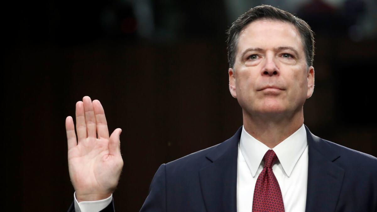 Former FBI Director James Comey is sworn in during a Senate Intelligence Committee hearing on Capitol Hill on June 8.