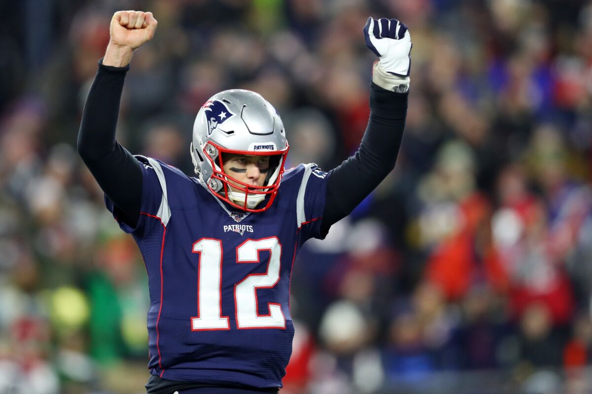 New England quarterback Tom Brady celebrates Rex Burkhead's go-ahead, one-yard touchdown run Dec. 21, 2019.