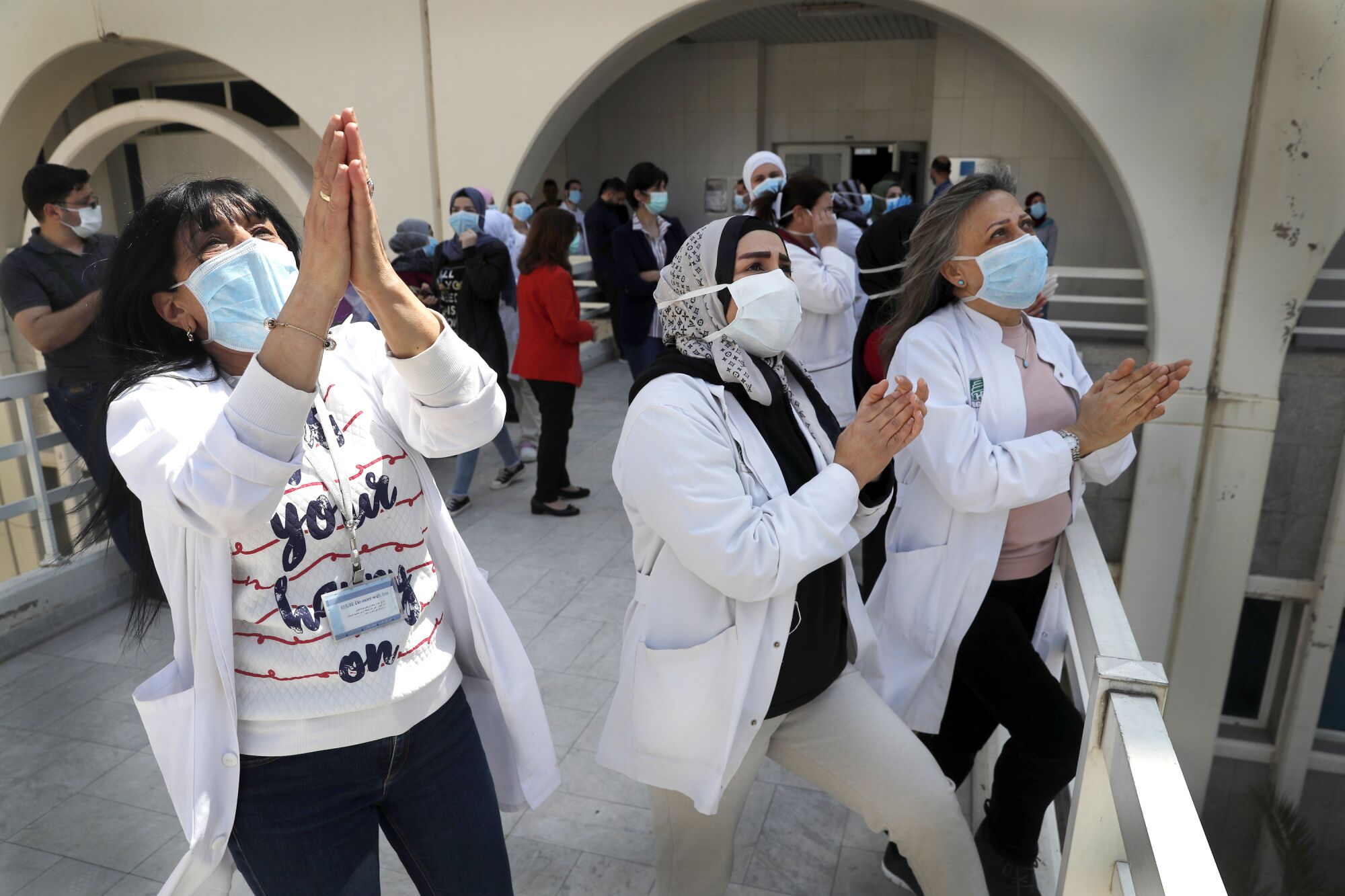 LEBANON: Nurses applaud a performance by musicians from Ahla Fawda, a nongovernmental organization, for staff and patients at Rafic Hariri University Hospital in Beirut on April 16.