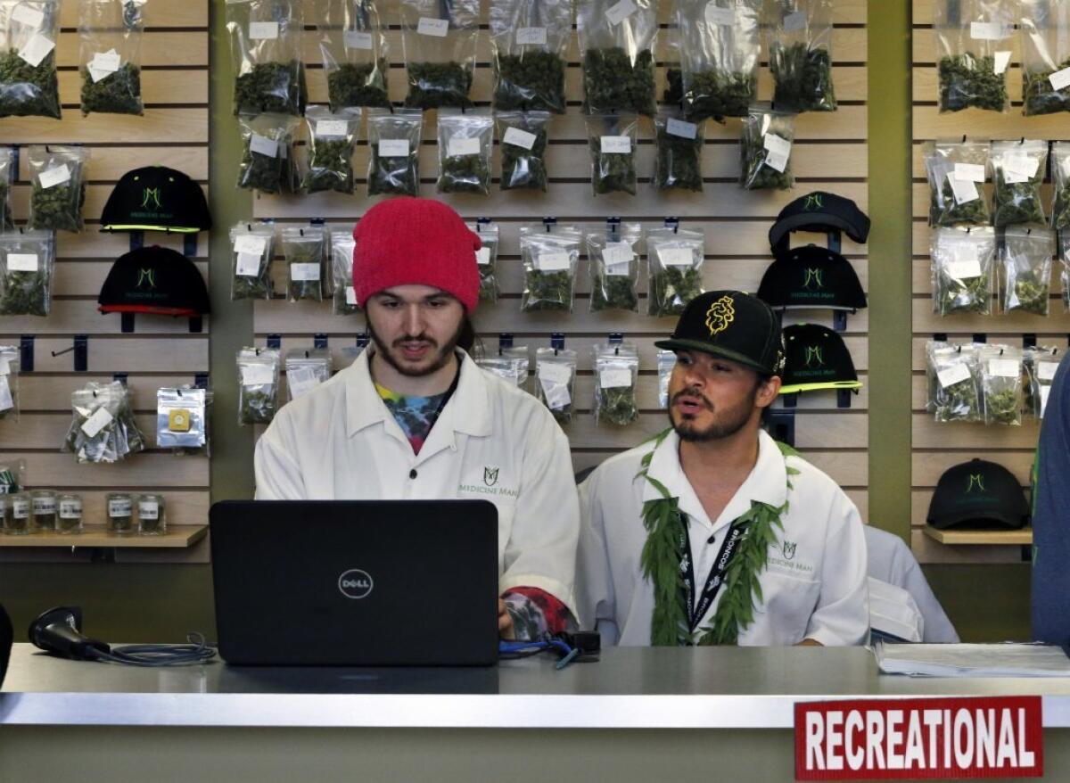 Workers in a Denver recreational marijuana shop.