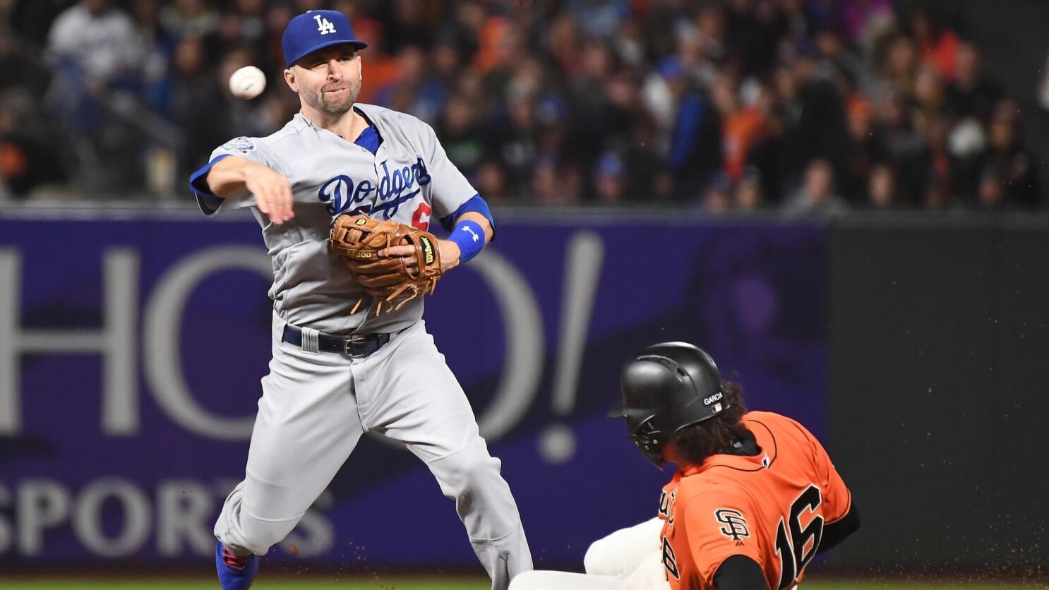 San Francisco Giants Madison Bumgarner blows on his hand during