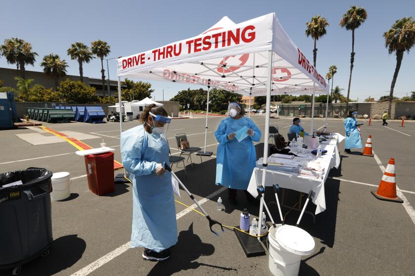 ANAHEIM, CALIFORNIA-JULY 11, 2020-Orange County residents will be able to get tested at no cost for COVID-19 at the Anaheim Convention Center starting today, July 15, 2020. Clinicians from 360 Clinic are administering the test kits, but citizens will do their own sample taking. (Carolyn Cole/Los Angeles Times)