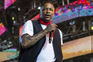 FILE - In this April 14, 2019, file photo, rapper YG performs at the Coachella Music & Arts Festival in Indio, Calif. YG, whose real name is Keenon Jackson ,was arrested Friday, Jan. 24, 2020, at his Los Angeles home on suspicion of robbery just two days before he is scheduled to perform at the Grammy Awards, officials said. (Photo by Amy Harris/Invision/AP, File)