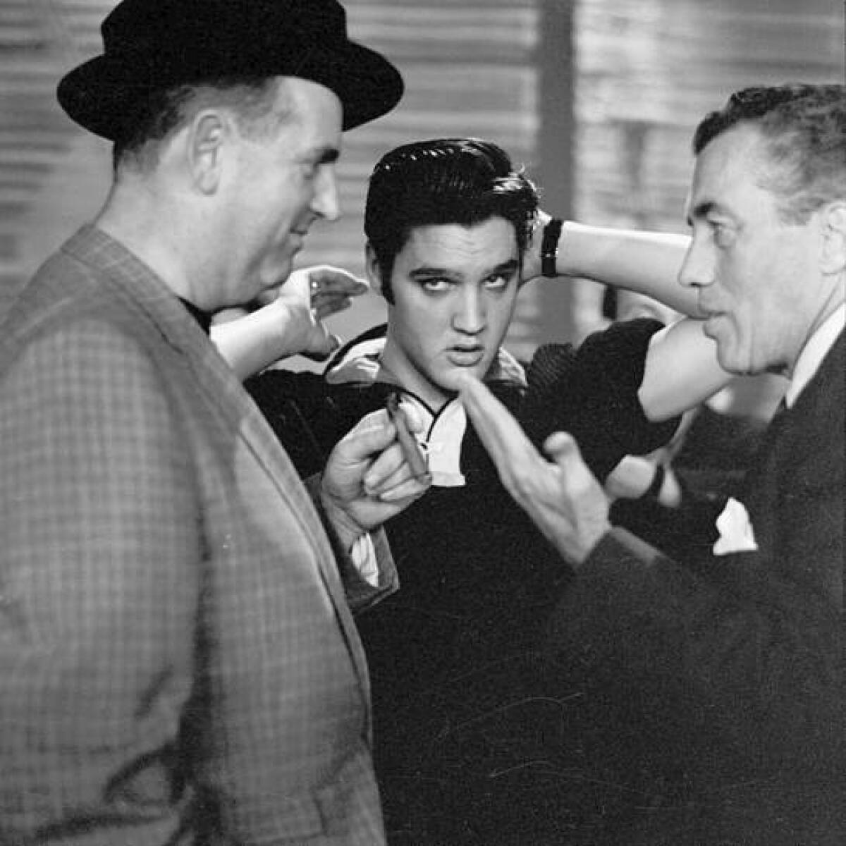 Elvis Presley, center, with his manager, Col. Tom Parker, left, and host Ed Sullivan before Presley's second appearance on "The Ed Sullivan Show," Oct. 28, 1956.