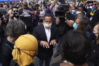 FILE - Minnesota Attorney General Keith Ellison, center, speaks with Rep. Ilhan Omar, D-Minn., and members of the Congressional Black Caucus as they visit the site of George Floyd's death in south Minneapolis on June 4, 2020. (Anthony Souffle/Star Tribune via AP, File)