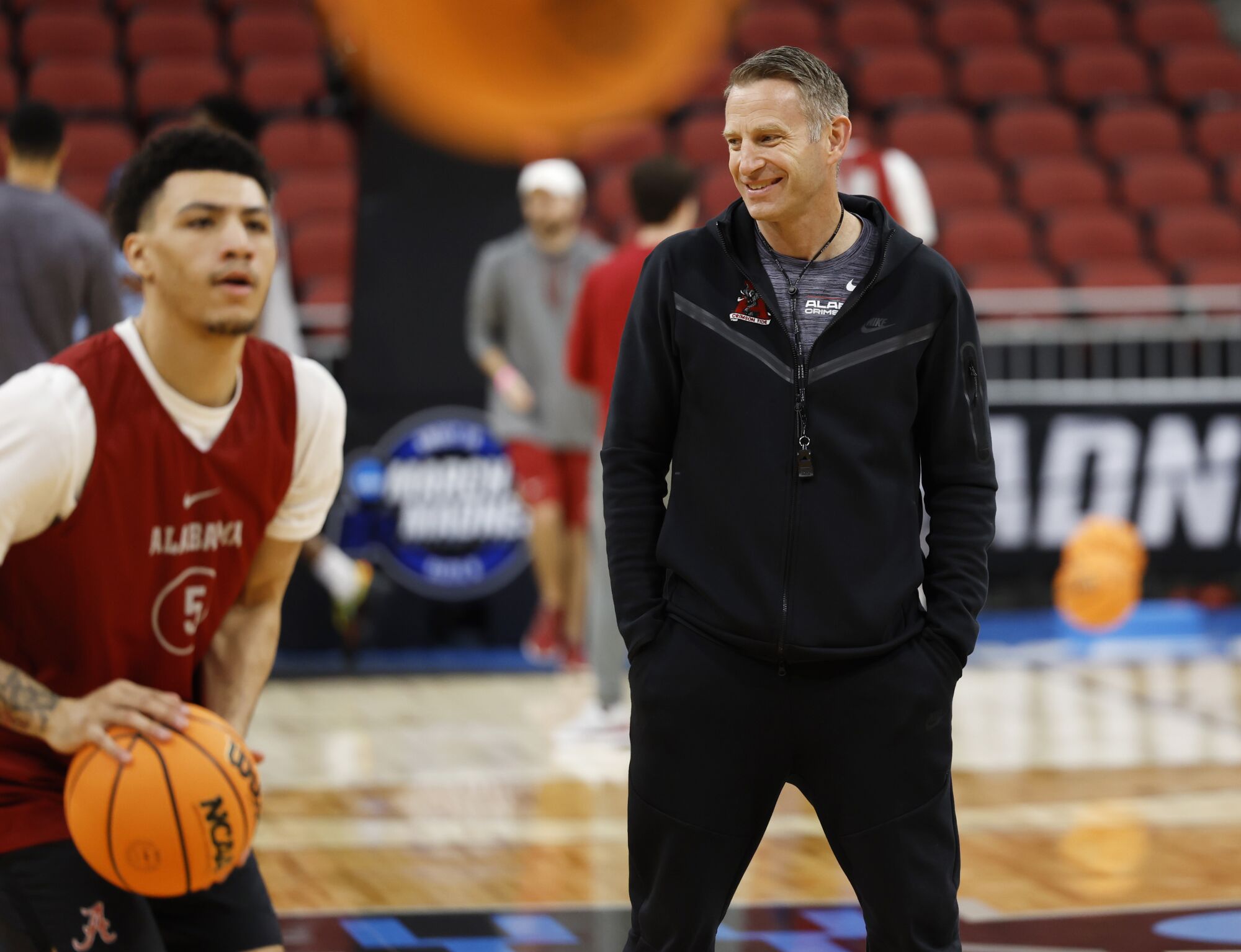 Alabama coach Nate Oats looks on during Thursday's practice in Louisville.