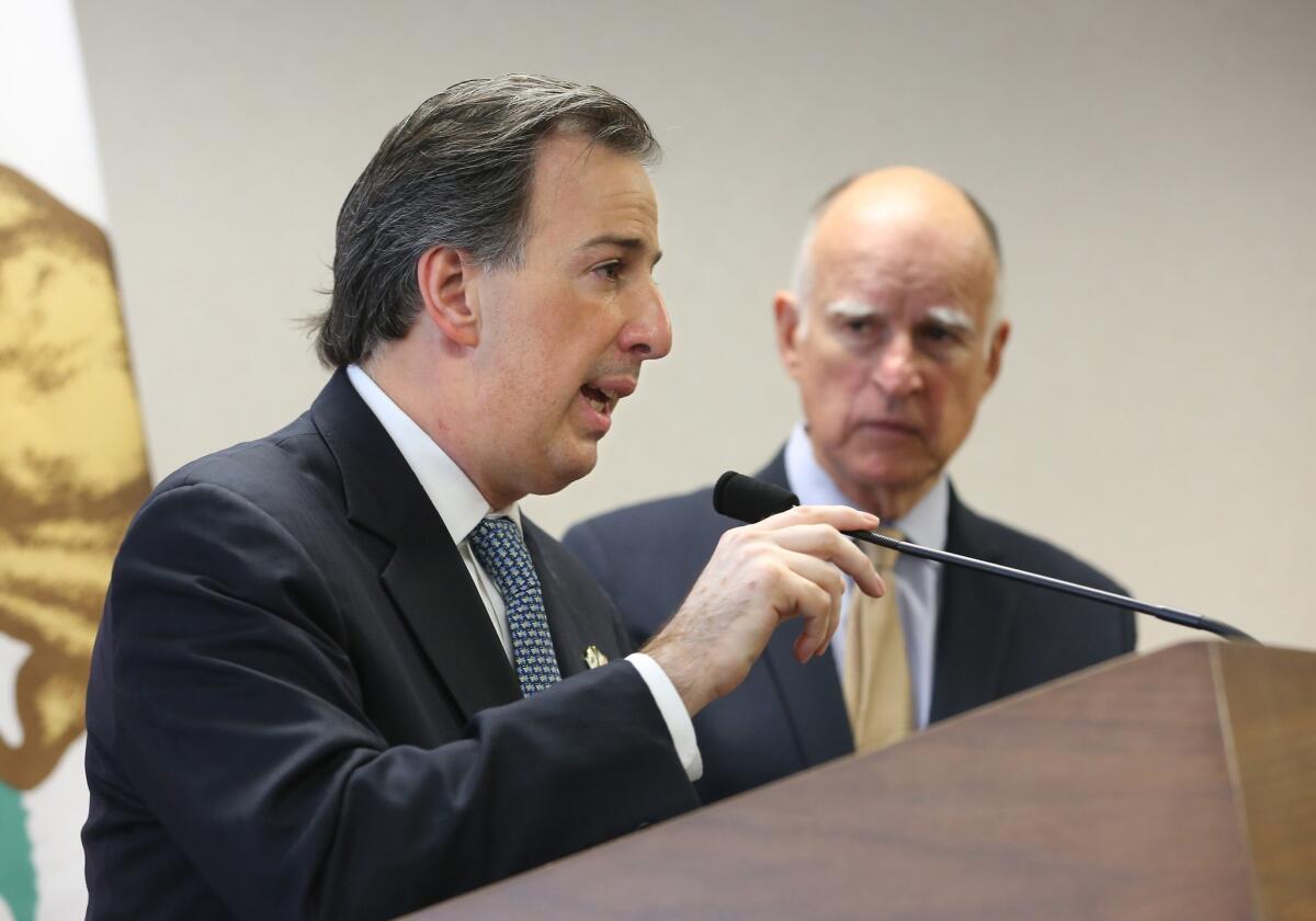 As Gov. Jerry Brown looks on, Mexican Secretary of Foreign Affairs Jose Antonio Meade Kuribrena, left, responds to a reporter's question during a news conference on July 23 in Sacramento.