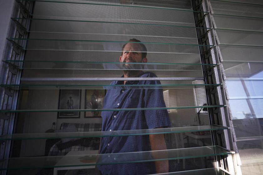 SAN DIEGO, CA - AUGUST 25: Jeff Arns, at his Pacific Beach apartment, Aug. 25, 2022 where he lives with his son and daughter. He earns a good wage, but because of inflation and all that goes with it in the economy, is having challenges financially. (Howard Lipin / For The San Diego Union-Tribune)