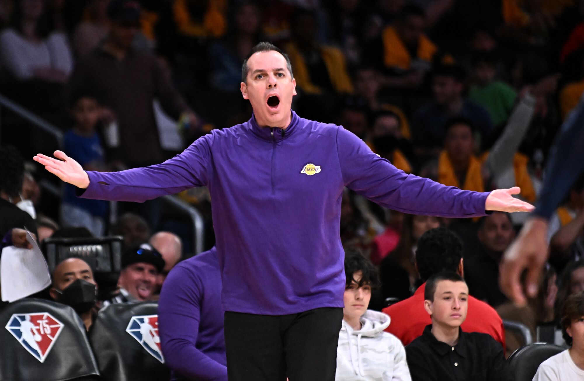 Lakers coach Frank Vogel argues with a referee during a game against the Nuggets.