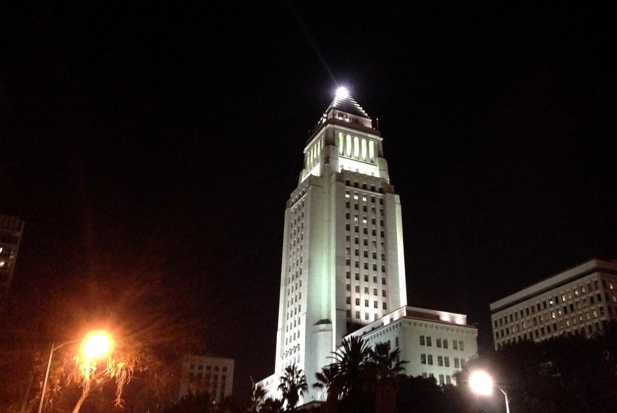 The Lindbergh beacon lights up above L.A. City Hall.
