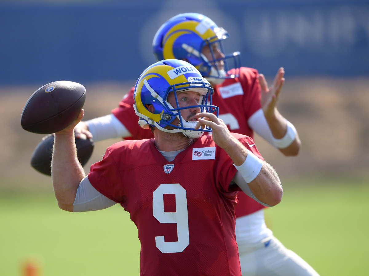 Rams quarterback John Wolford throws next to Jared Goff during training camp in August. 