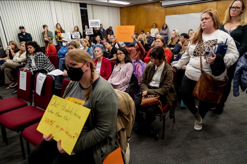 ORANGE, CA - JANUARY 19, 2023: Concerned parents pack the Orange Unified School District Board of Education meeting to protest the abrupt firing of Superintendent Gunn Marie Hansen on January 19, 2023 in Orange, California. (Gina Ferazzi / Los Angeles Times)