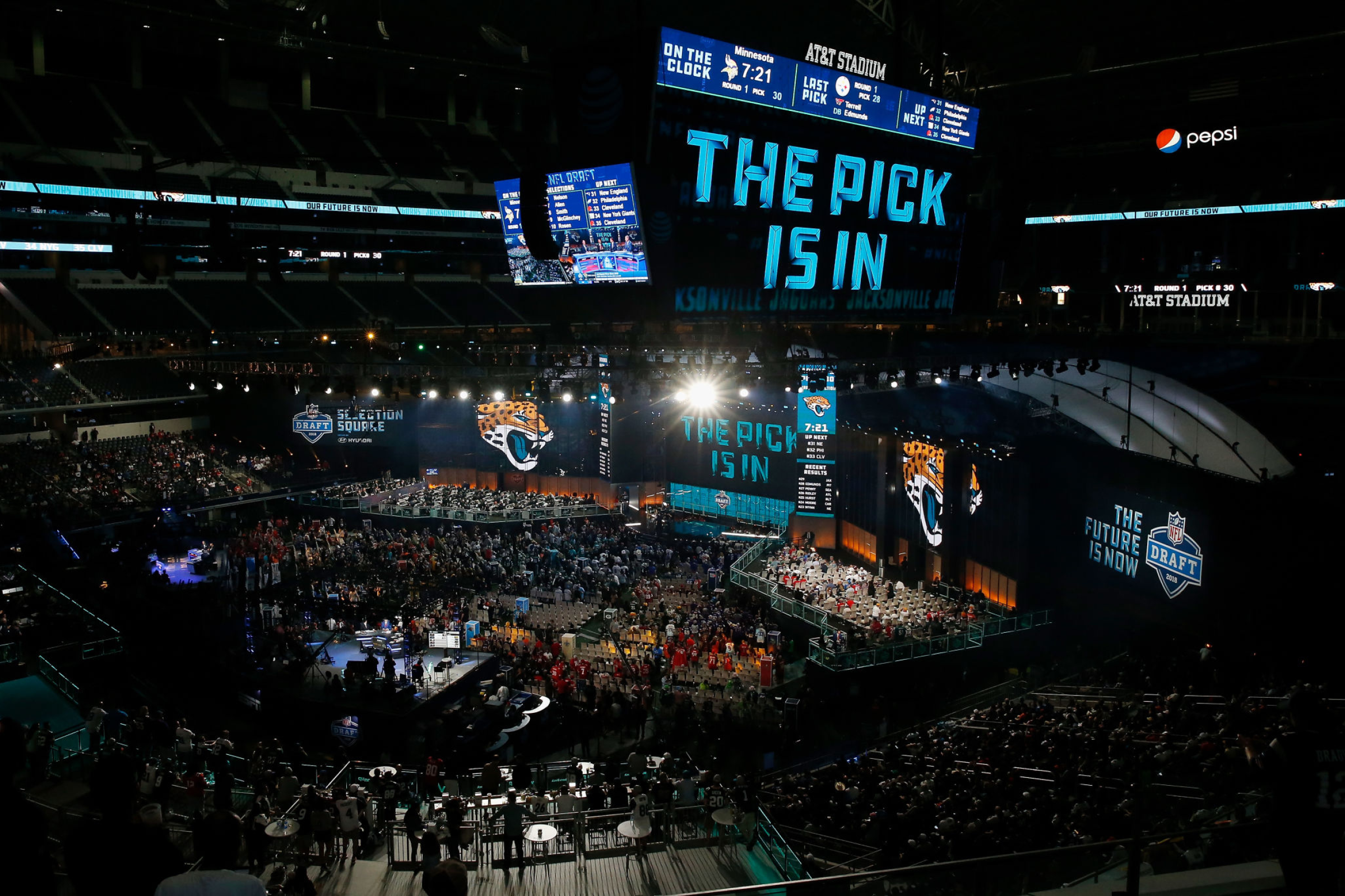A video board at AT&T Stadium in Arlington, Texas, displays "The pick is in" for the Jacksonville Jaguars at the 2018 draft.
