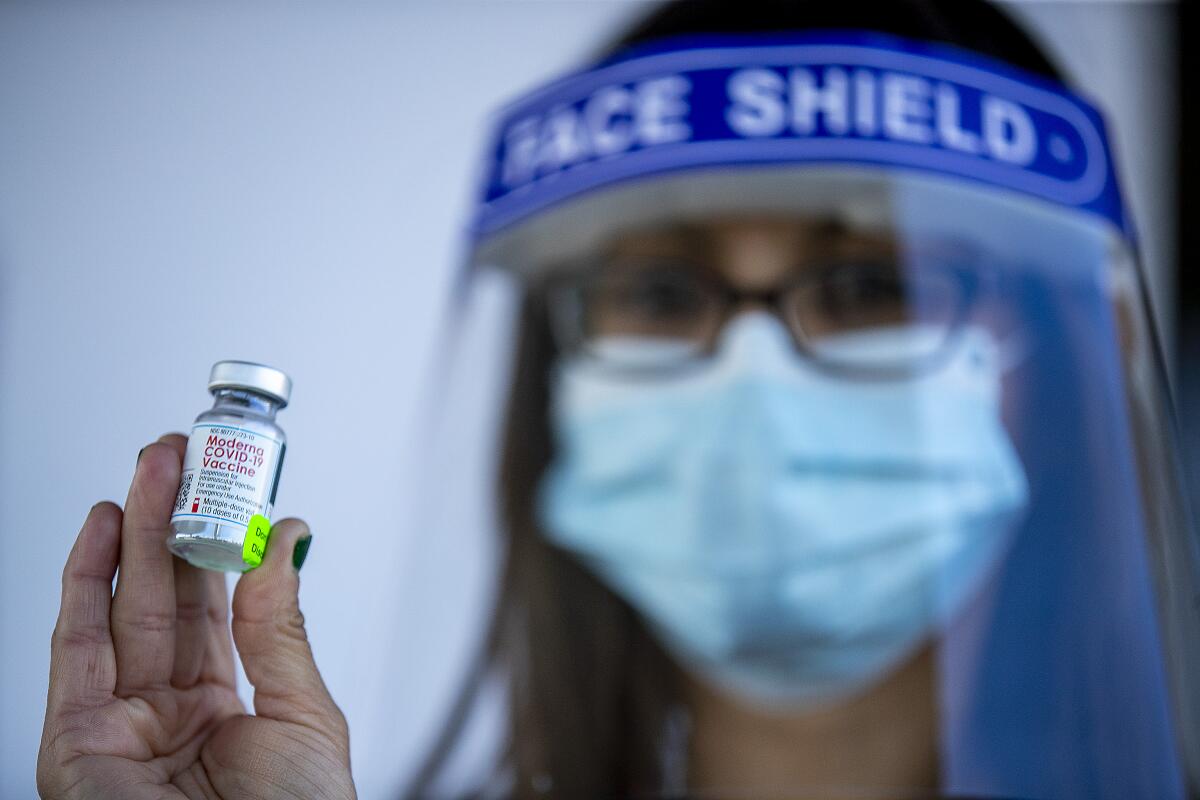 A nurse holds a vial of Moderna COVID-19 vaccine in Anaheim on Jan. 28. 