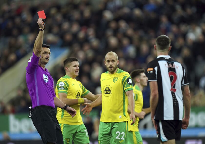 Newcastle United's Ciaran Clark is sent off during the English Premier League soccer match between Newcastle United and Norwich City at St James' Park, Newcastle, England, Tuesday Nov. 30, 2021. (Mike Egerton/PA via AP)