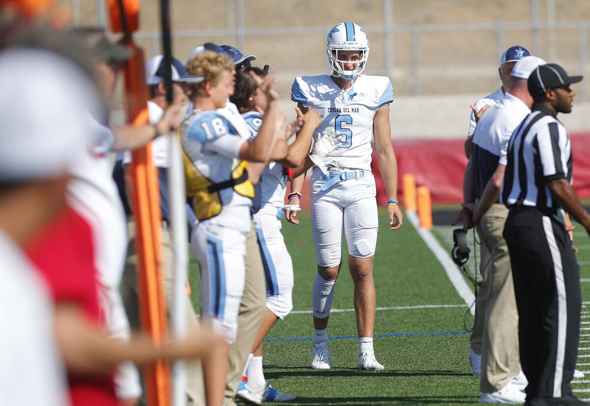 Corona del Mar's John Humphreys stands on the sideline with a wrap on his leg. He didn't play in the first half at Palos Verdes in a nonleague game on Friday.