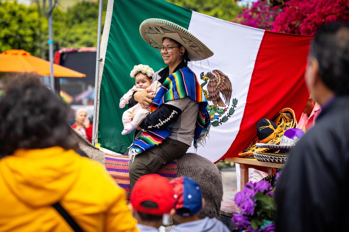 Families enjoy the Cinco de Mayo Fiesta at Olvera Street.