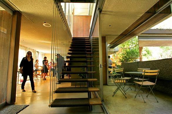 The mid-1960s design by Neutra and son Dion demonstrates many of the ideas that modern homes still employ today. Here, wide glass doors on the main floor open to the outdoors.