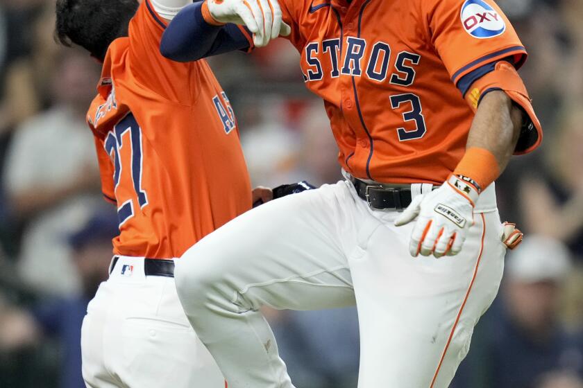 Houston Astros' Jeremy Pena (3) celebrates his three-run home run against the Milwaukee Brewers with Jose Altuve during the fifth inning of a baseball game Friday, May 17, 2024, in Houston. (AP Photo/Eric Christian Smith)