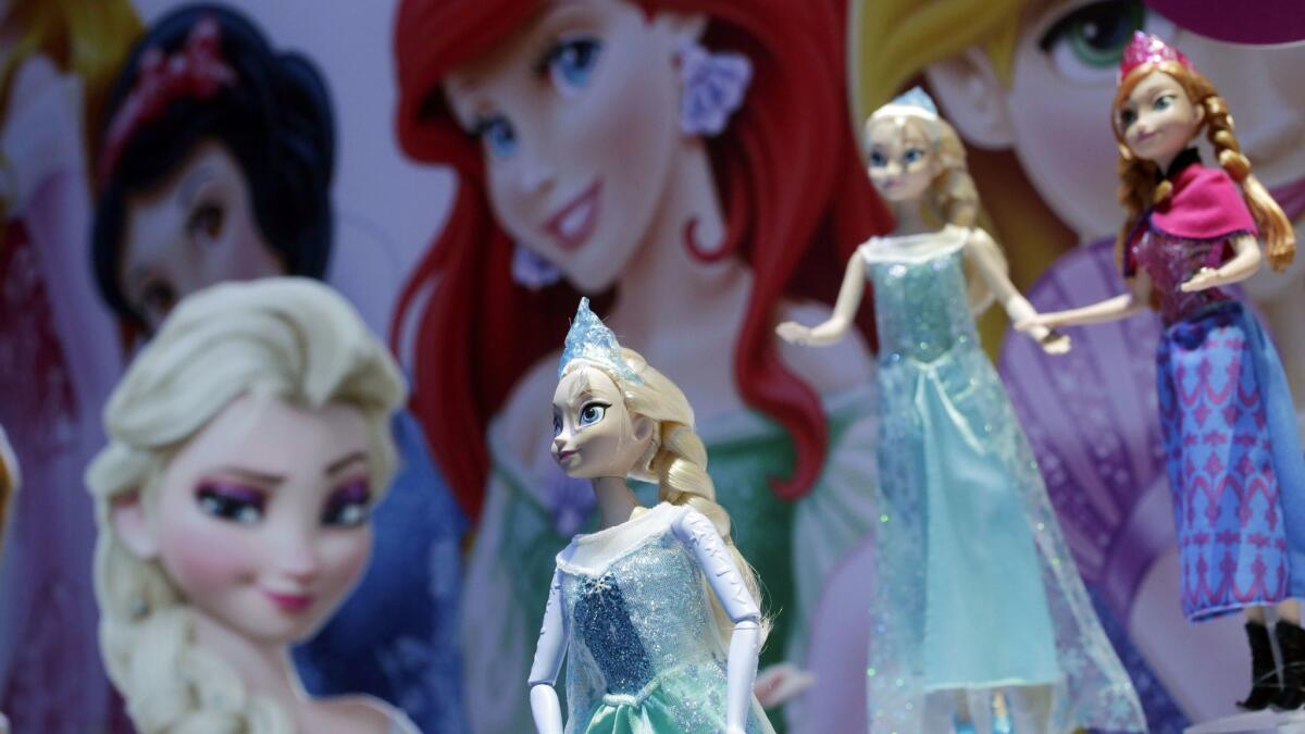 Disney Frozen Feature Fashion Dolls are displayed at the Mattel booth at the American International Toy Fair in New York.