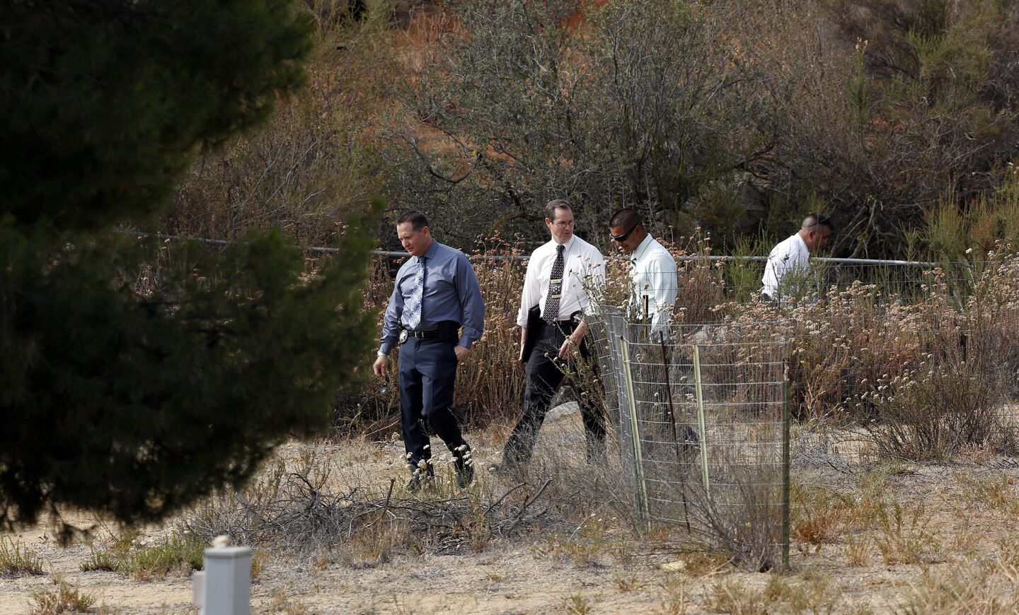 Riverside County sheriff's investigators look for signs of 11-year-old Terry Dewayne Smith at his Menifee home.