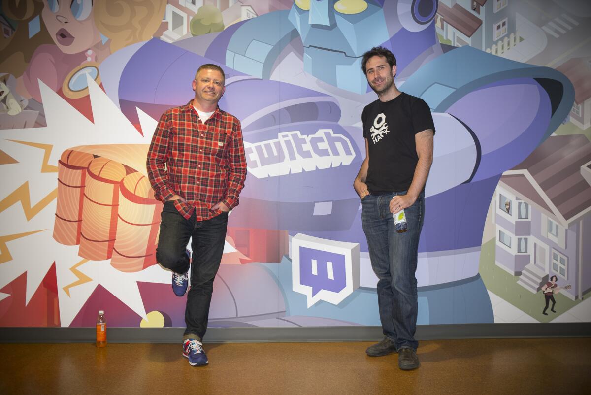 Jonathan Simpson-Bint and Emmet Shear, right, executives at Twitch, pose at the firm's offices in San Francisco on May 20, 2014.