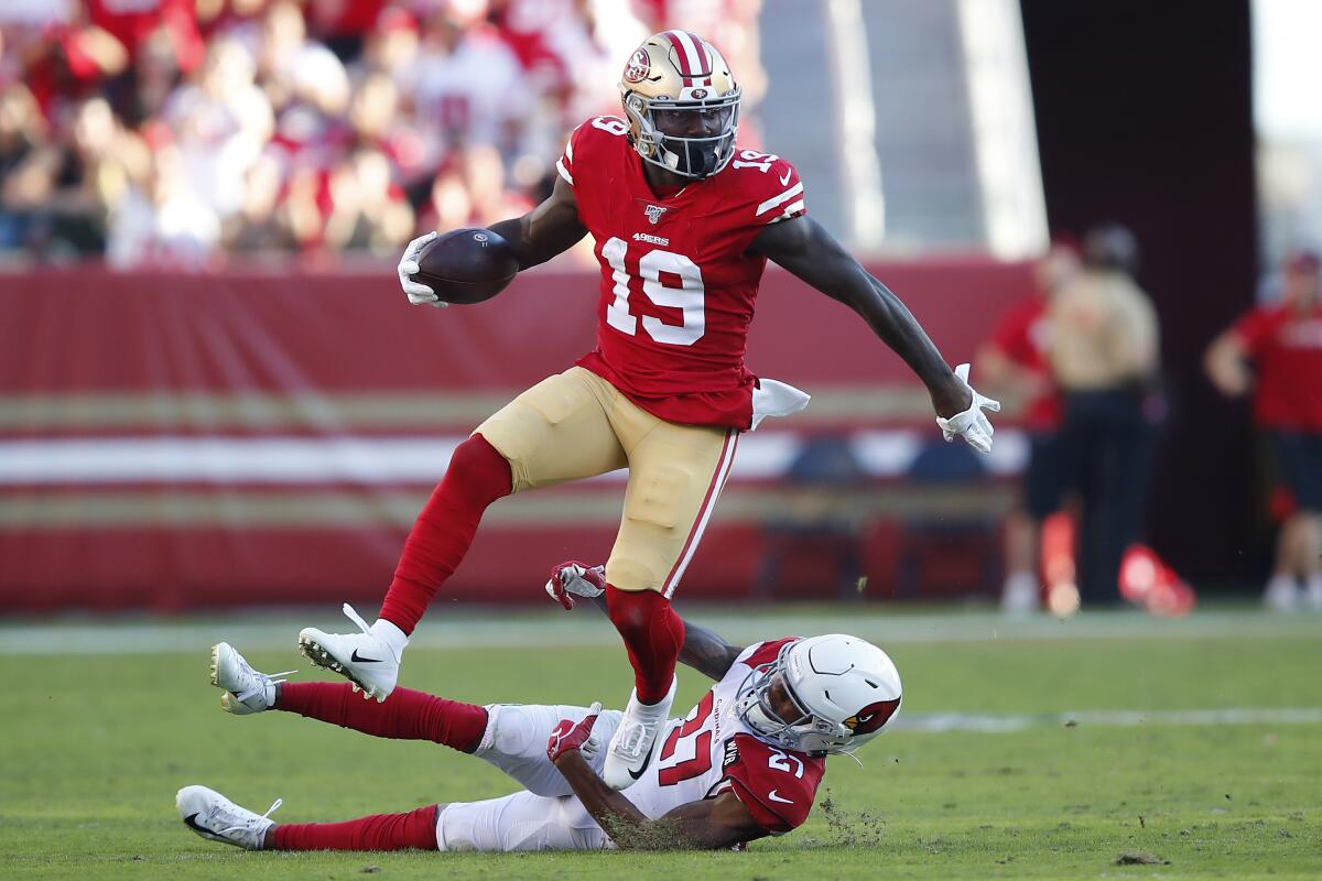 San Francisco 49ers wide receiver Deebo Samuel (19) runs between