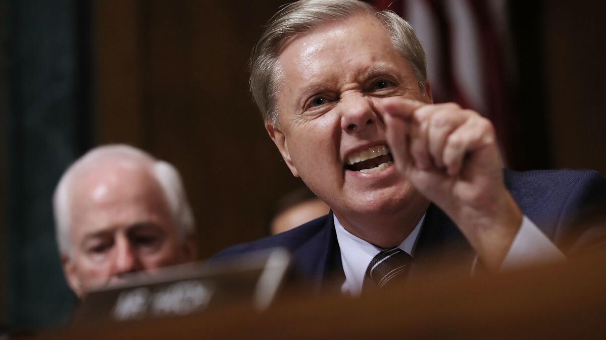 Senate Judiciary Committee member Sen. Lindsey Graham (R-S.C.) shouts while questioning Judge Brett Kavanaugh during his Supreme Court confirmation hearing.