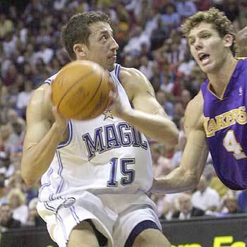Orlando Magic's Hedo Turkoglu prepares to shoot while being defended by Los Angeles Lakers' Luke Walton