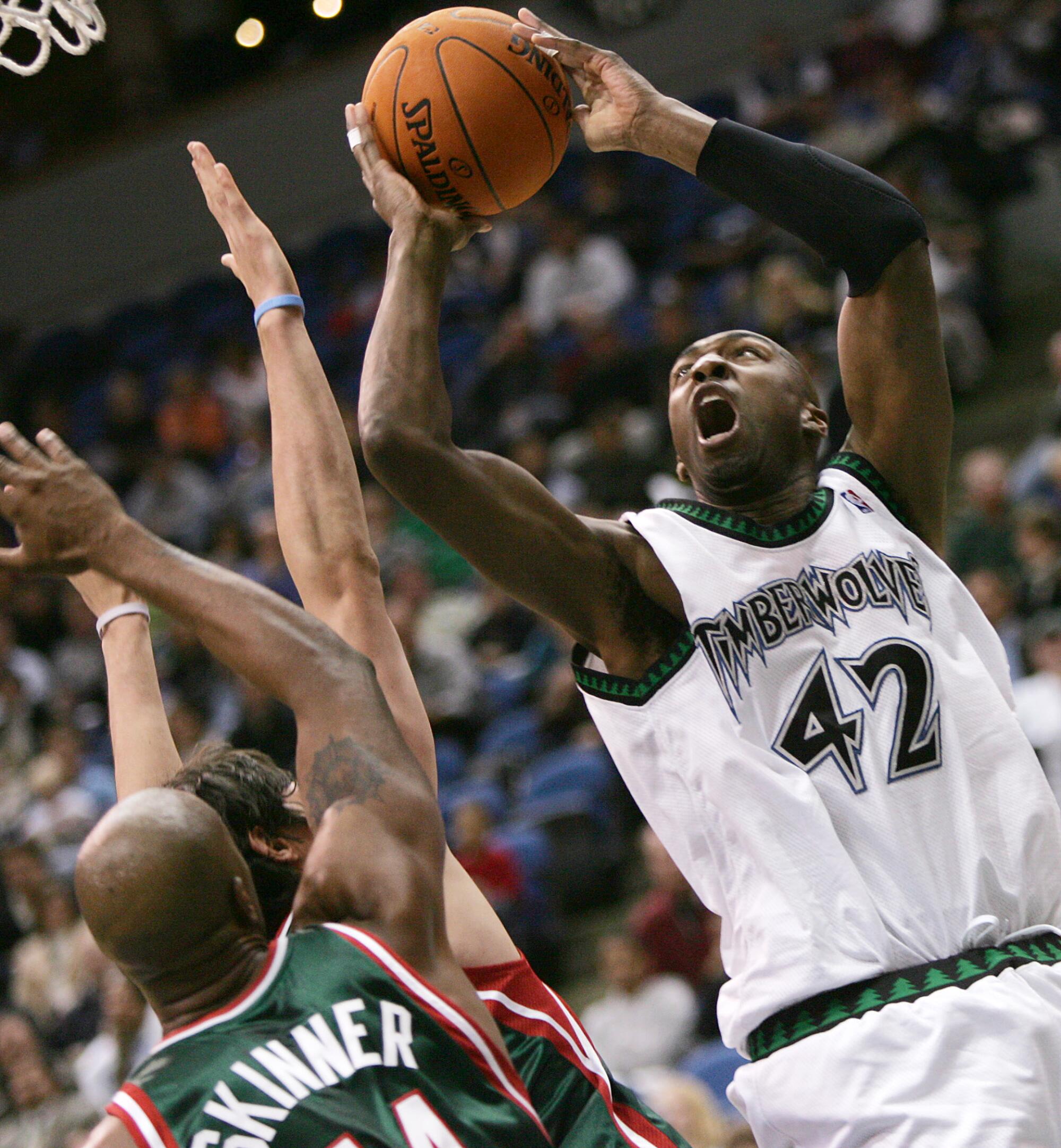 Vin Baker tries to score against the Bucks while playing for the Timberwolves in 2006.