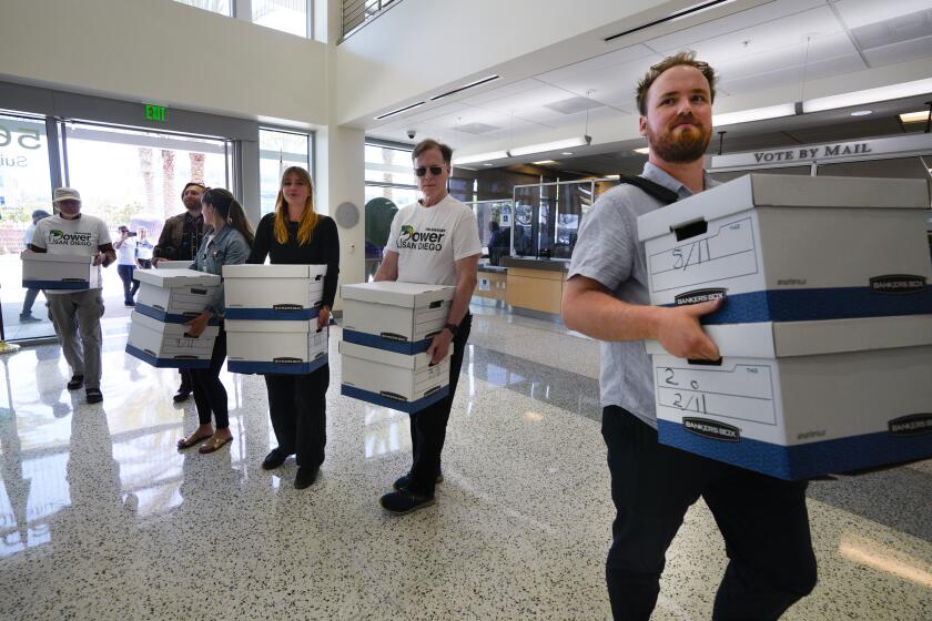 San Diego, CA - May 14: On Tuesday, May 14, 2024 in San Diego, at the San Diogo County Registrar of Voter's office, volunteers delivered boxes containing approximately 31,000 signatures on a petition to replacing SDGE with a not for profit municipal electric distribution utility. (Nelvin C. Cepeda / The San Diego Union-Tribune)