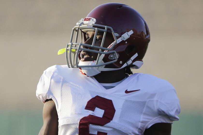 USC's Adoree' Jackson carries the ball during a team practice session on Aug. 20, 2014.