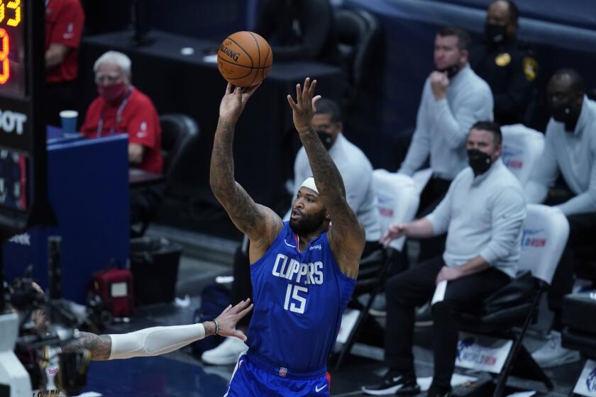 LA Clippers center DeMarcus Cousins (15) shoots in the first half of an NBA basketball game against the New Orleans Pelicans in New Orleans, Monday, April 26, 2021. (AP Photo/Gerald Herbert)
