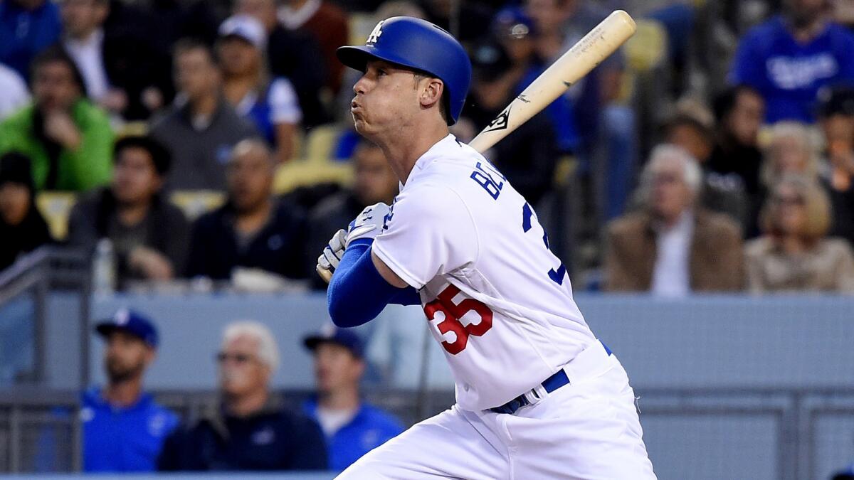 Cody Bellinger watches his two-run home run during Dodgers' game against the Pirates at Dodger Stadium on May 10.