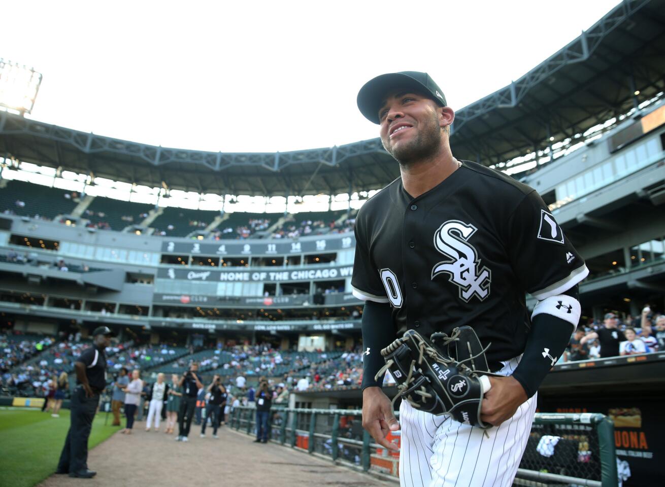 White Sox second baseman Yoan Moncada exits the dugout to warm up before a game against the Los Angeles Dodgers at Guaranteed Rate Field on July 19, 2017.