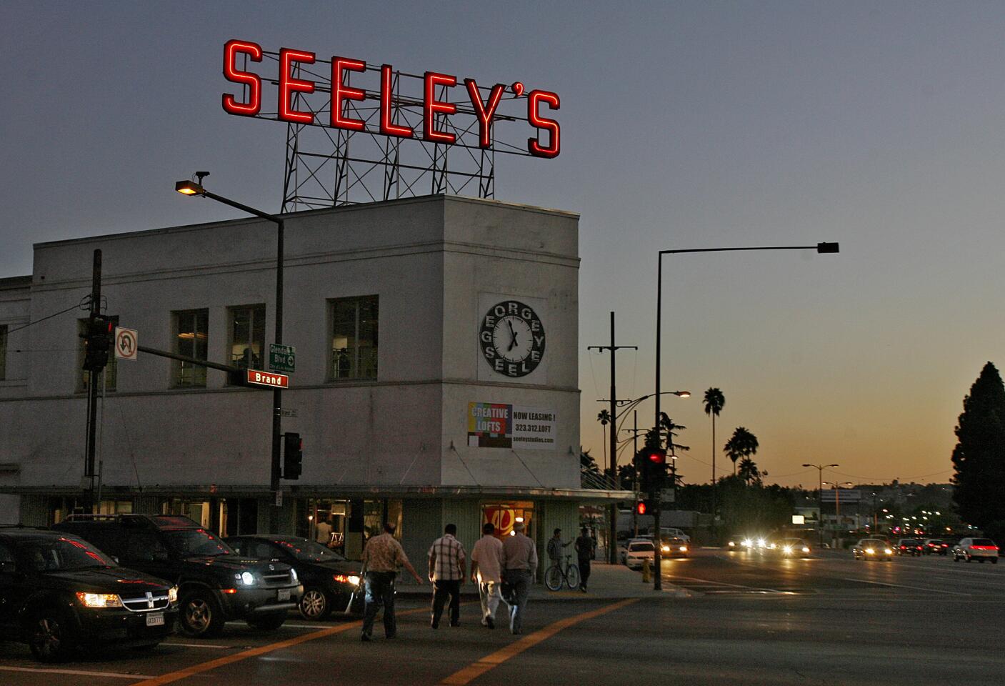 The illuminated Seeley's sign atop the Seeley Building in Glendale.