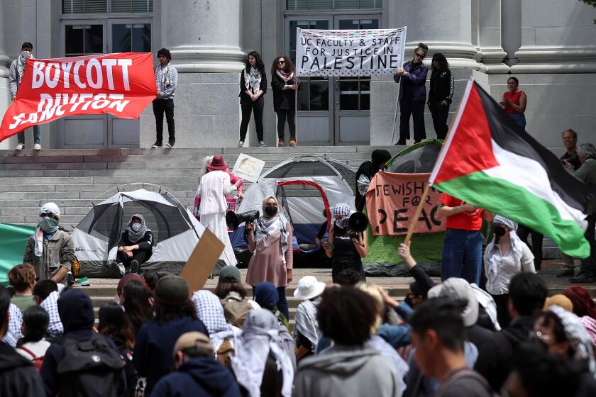 BERKELEY, CALIFORNIA - APRIL 22: Pro-Palestinian protesters set up a tent encampment during a demonstration in front of Sproul Hall on the UC Berkeley campus on April 22, 2024 in Berkeley, California. Hundreds of pro-Palestinian protesters staged a demonstration in front of Sproul Hall on the UC Berkeley campus where they set up a tent encampment in solidarity with protesters at Columbia University who are demanding a permanent cease fire in war between Israel and Gaza. (Photo by Justin Sullivan/Getty Images)