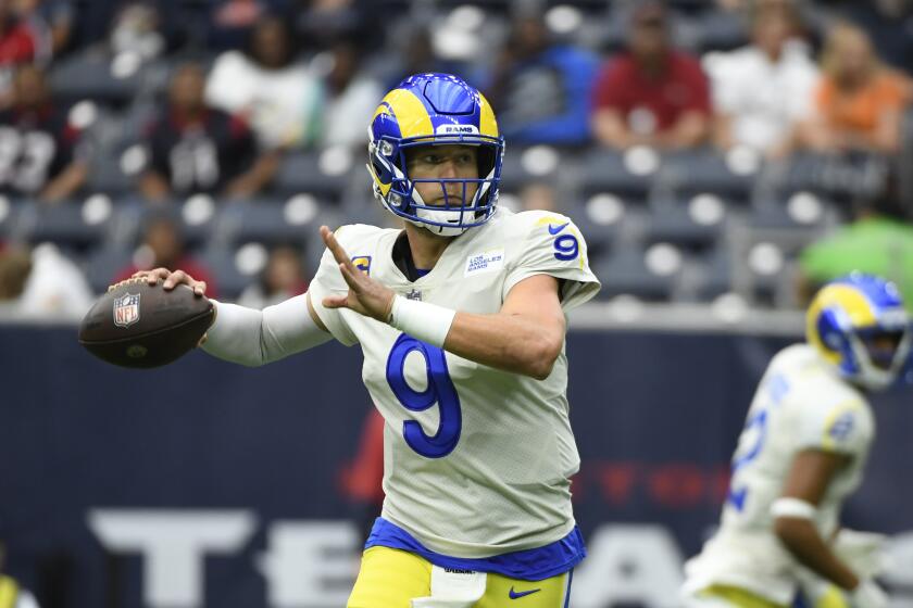 Los Angeles Rams quarterback Matthew Stafford (9) looks to throw against the Houston Texans during an NFL football game, Sunday, Oct. 31, 2021, in Houston. (AP Photo/Justin Rex )