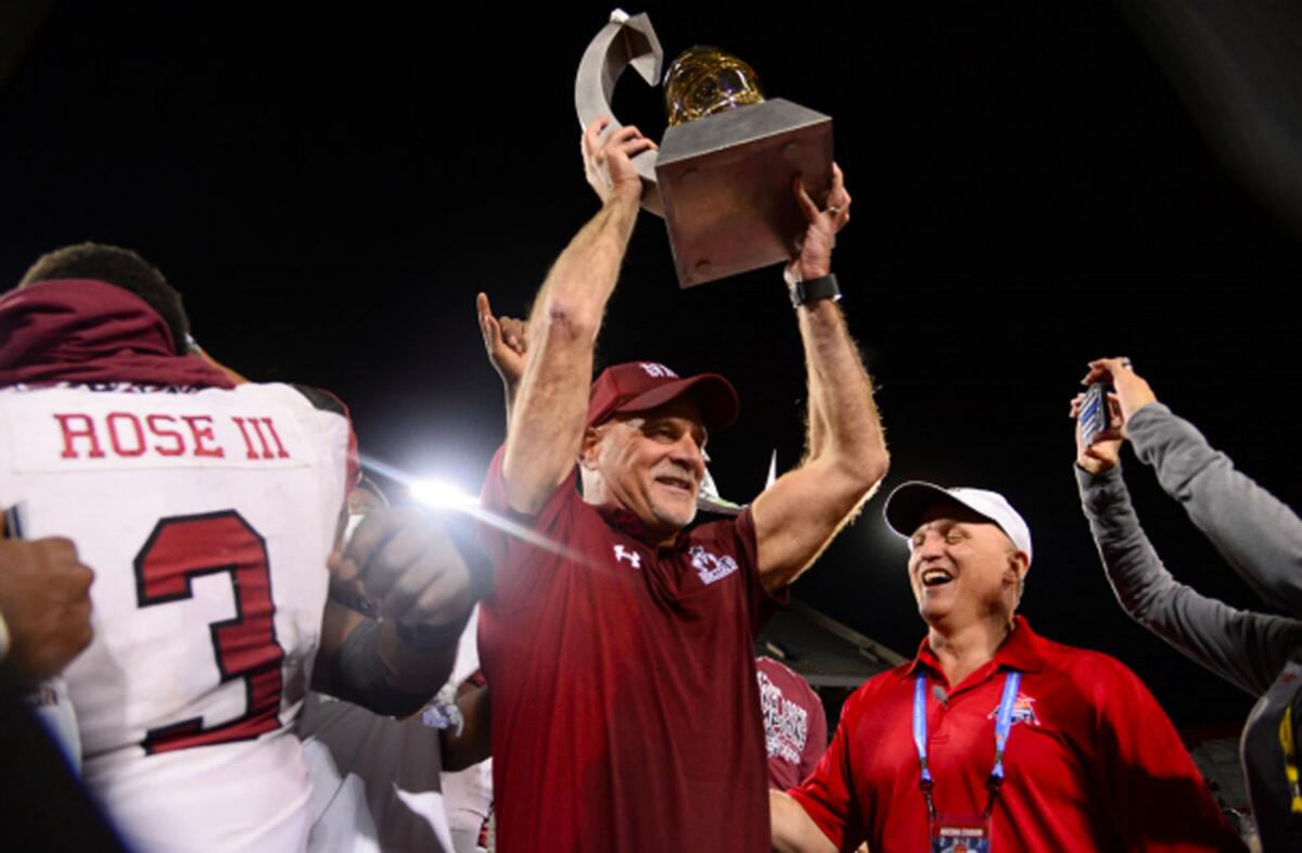 New Mexico State head coach Doug Martin celebrates win at 2017 Arizona Bowl, the school's only bowl appearance in 60 years.