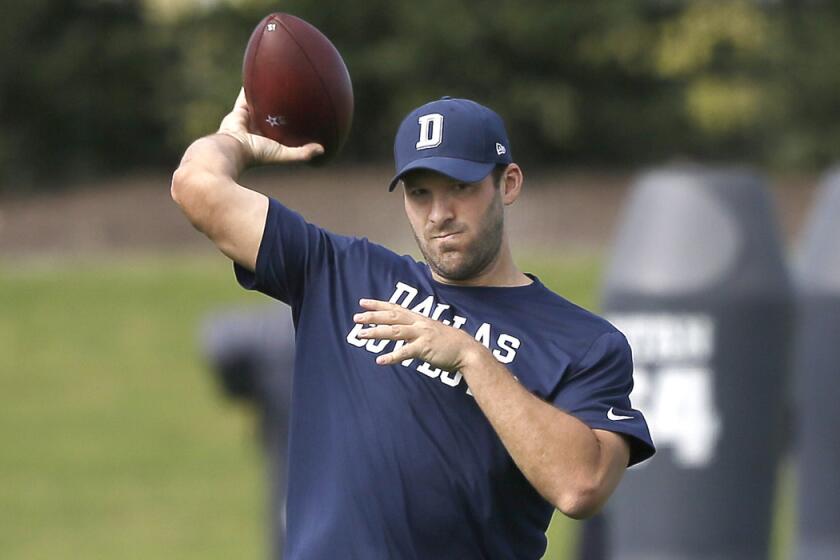 Dallas Cowboys quarterback Tony Romo throws during football practice at the team's practice facility Wednesday.